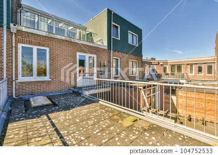 an outside area with some buildings in the back and one on the other side there is a fence that has been used to protect an outside area with some buildings in the back and one on the other side there is a fence that has been used to protect 104752533
