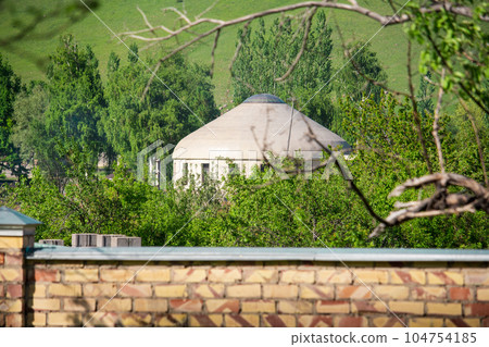 White yurt among green trees on a hill. Asian traditions 104754185