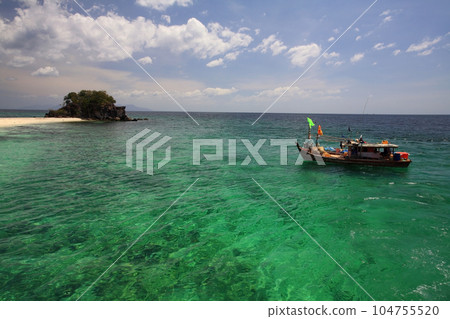 Fisherman boat on Andaman turquoise at Ko Lipe island 104755520