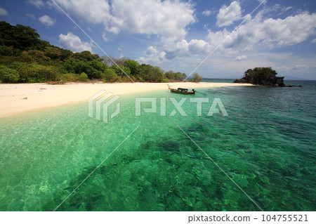 boat on Andaman turquoise sea at Ko Lipe island, Satun boat on Andaman turquoise sea at Ko Lipe island, Satun 104755521
