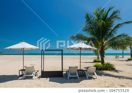 Relax sunbed or deck chairs with parasol on beach, Cha Am 104755529