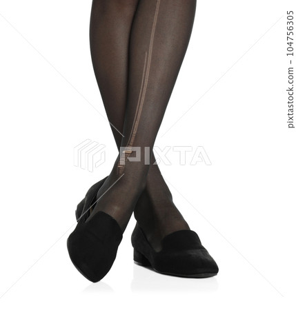 Woman wearing torn tights on white background, closeup 104756305