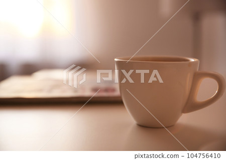 Cup of hot drink on table, space for text. Lazy morning 104756410