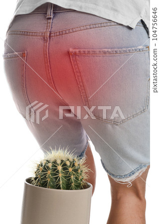 Man sitting down on cactus against white background, closeup. Hemorrhoid concept 104756646