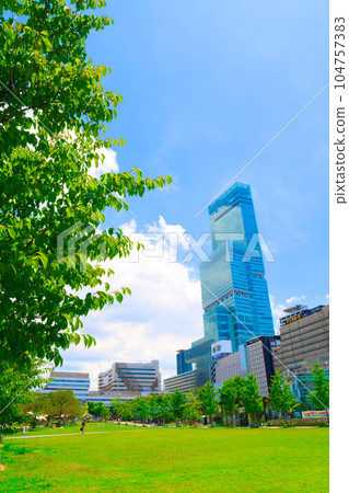[Osaka Prefecture] Scenery in front of Tennoji Station in the big city with blue sky in July 104757383