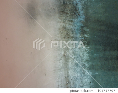A bird's eye view of a red salt lake and black earth, captured by a drone. A bird's eye view of a red salt lake and black earth, captured by a drone. 104757797
