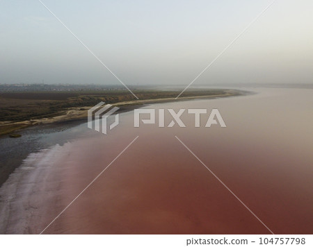 Pink Koyashskoye salt lake in Krym and Black Sea coast. Aerial view. Pink Koyashskoye salt lake in Krym and Black Sea coast. Aerial view. 104757798