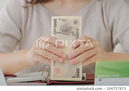 young woman counting money young woman counting money 104757873
