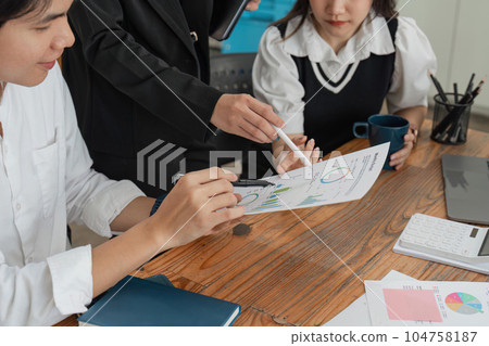 Businesspeople analyzing investment graph meeting brainstorming and discussing plan in meeting room at office, investment concept Businesspeople analyzing investment graph meeting brainstorming and discussing plan in meeting room at office, investment concept 104758187