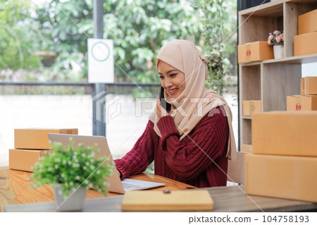 Beautiful Muslim woman selling online at home, business owner, business sme concepts 104758193