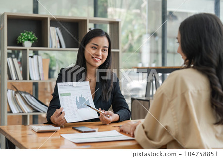 Business people are meeting for analysis data figures to plan business strategies. Business discussing concept 104758851