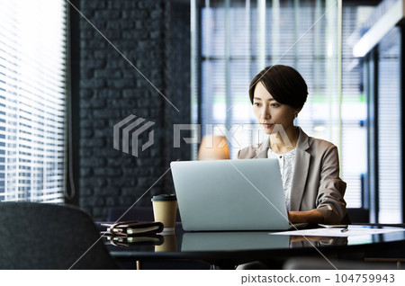 Female business computer serious thinking 104759943