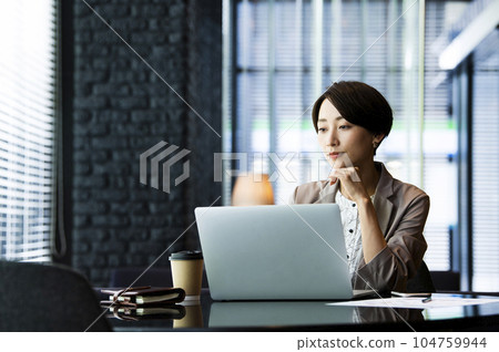 Female business computer serious thinking 104759944