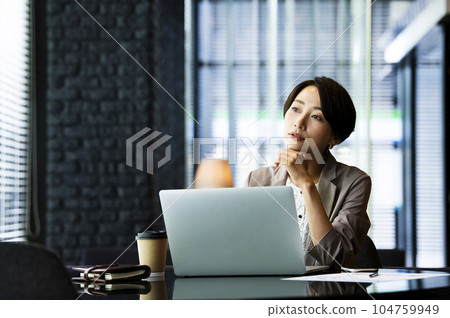 Female business computer serious thinking 104759949