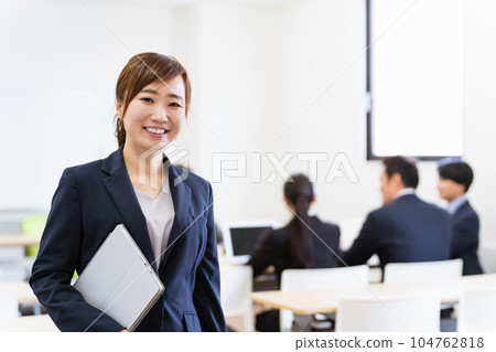 Business woman with laptop in office (IT company) Business woman with laptop in office (IT company) 104762818