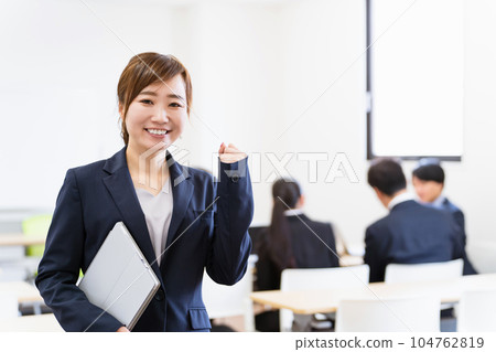 Business woman with laptop in office (IT company) Business woman with laptop in office (IT company) 104762819