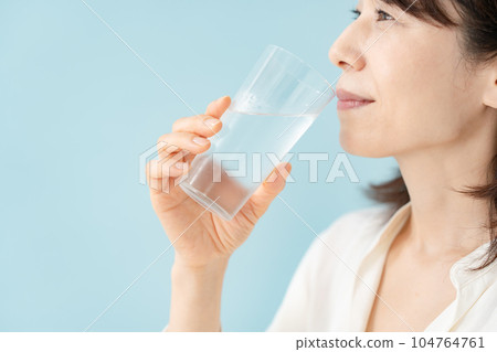 Senior woman drinking water Senior woman drinking water 104764761