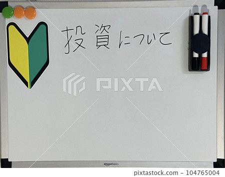 Learning about investing on a whiteboard stock photo Learning about investing on a whiteboard stock photo 104765004