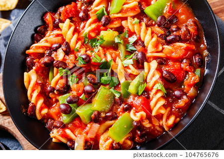 Black Bean Soup with spiral pasta and vegetables Black Bean Soup with spiral pasta and vegetables 104765676
