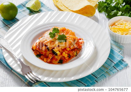 enchilada casserole with veggies, corn, pinto bean enchilada casserole with veggies, corn, pinto bean 104765677