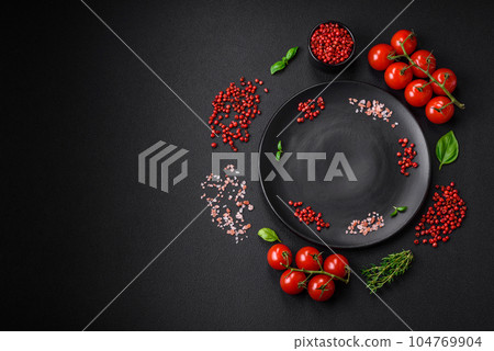 Ingredients for cooking cherry tomatoes, salt, spices and herbs Ingredients for cooking cherry tomatoes, salt, spices and herbs 104769904