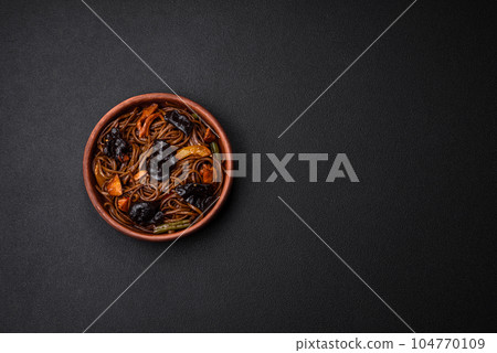 Delicious fresh buckwheat noodles or udon with mushrooms, peppers and other vegetables 104770109