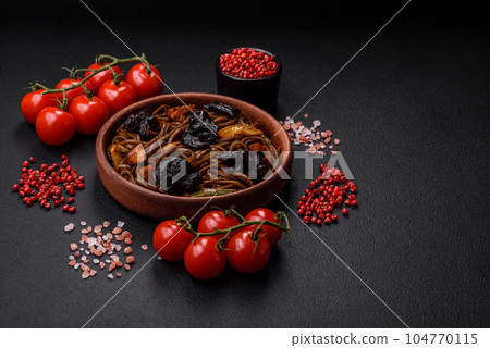Delicious fresh buckwheat noodles or udon with mushrooms, peppers and other vegetables 104770115