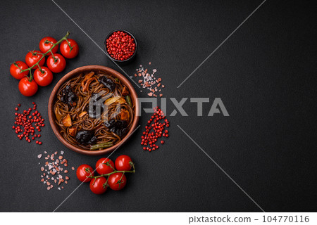 Delicious fresh buckwheat noodles or udon with mushrooms, peppers and other vegetables 104770116