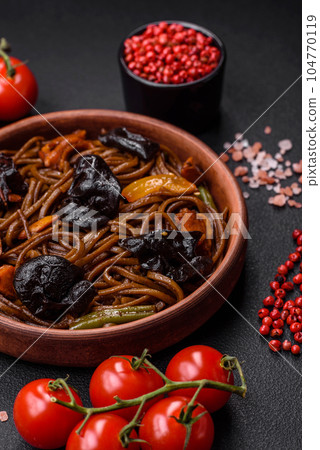 Delicious fresh buckwheat noodles or udon with mushrooms, peppers and other vegetables 104770119