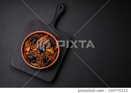 Delicious fresh buckwheat noodles or udon with mushrooms, peppers and other vegetables 104770125