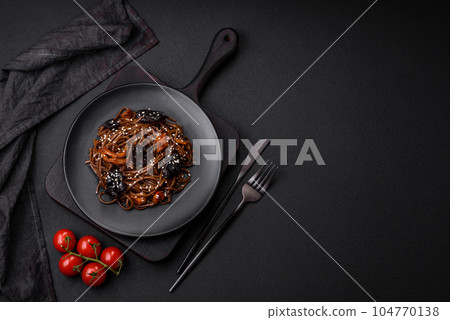 Delicious fresh buckwheat noodles or udon with mushrooms, peppers and other vegetables Delicious fresh buckwheat noodles or udon with mushrooms, peppers and other vegetables 104770138
