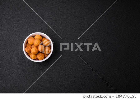 Delicious fried potato balls with breaded mozzarella, salt, spices and herbs Delicious fried potato balls with breaded mozzarella, salt, spices and herbs 104770153