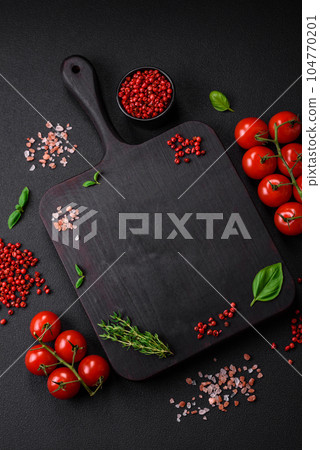 Ingredients for cooking cherry tomatoes, salt, spices and herbs Ingredients for cooking cherry tomatoes, salt, spices and herbs 104770201