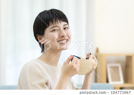 Young woman removing the mask 104771667