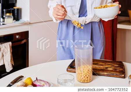 Closeup view of boiled chickpeas in blender Closeup view of boiled chickpeas in blender 104772352