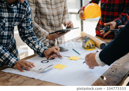 Engineer Teamwork Meeting, Drawing working on blueprint meeting for project working with partner on model building at company office. Asian industry professional team. Engineer Teamwork Meeting, Drawing working on blueprint meeting for project working with partner on model building at company office. Asian industry professional team. 104773333