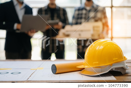 Engineer teams meeting working together wear worker helmets hardhat on construction site in modern city.Asian industry professional team in office Engineer teams meeting working together wear worker helmets hardhat on construction site in modern city.Asian industry professional team in office 104773390