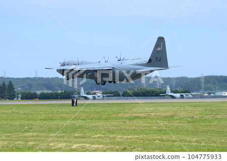 Transport plane taking off US military aircraft C130 transport plane taking off from Yokota Air Base 104775933