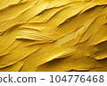 Texture of yellow paint applied to the wall. 104776468