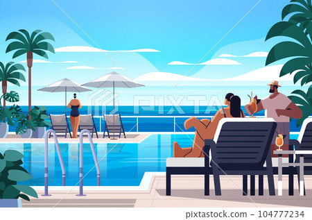people relaxing at tropical luxury resort hotel beach swimming pool and poolside seating area summer vacation concept 104777234