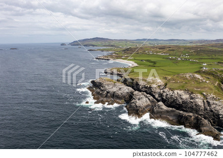 Aerial view of the coastline at Malin Head in Ireland. 104777462