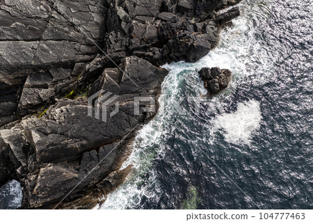 Aerial view of the coastline at Malin Head in Ireland. Aerial view of the coastline at Malin Head in Ireland. 104777463