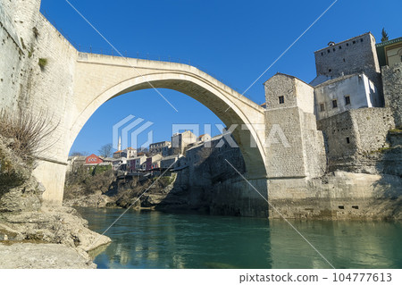 Stari Most in Mostar and the Neretva River / Mostar, Bosnia-Herzegovina Stari Most in Mostar and the Neretva River / Mostar, Bosnia-Herzegovina 104777613