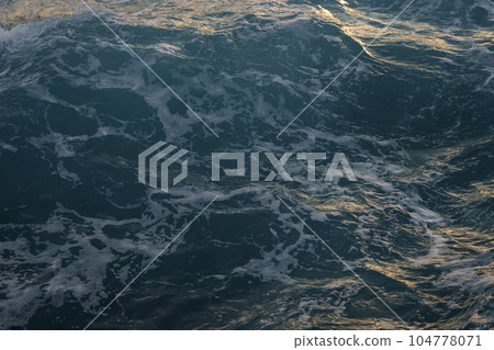 Stormy mediterranean sea during sunset on a french riviera coastline 104778071