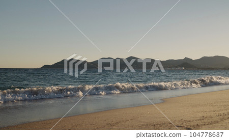 shot of evening waves on Cannes beach before sunset 104778687