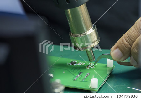 Close up scene the soldering operation by skill operator. 104778936