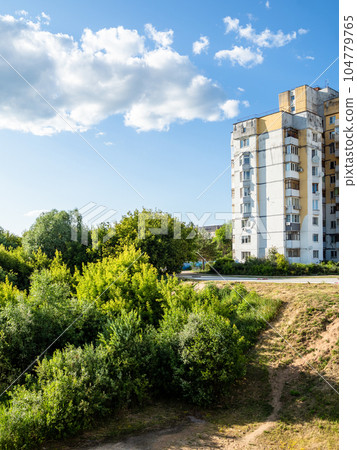 residential building on edge of green ravine residential building on edge of green ravine 104779765