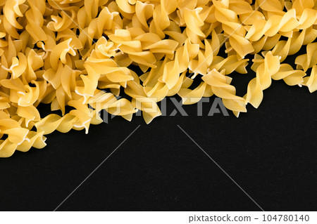 Uncooked Fusilli Pasta with Copy Space Uncooked Fusilli Pasta with Copy Space 104780140