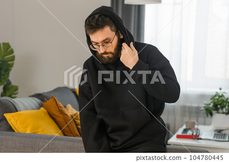 Sad man pondering about his life after a relationship breakup or bipolar disorder - depression asthenia , mental problem and anxiety disorder concept 104780445