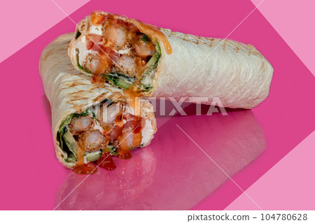 Meatloaf with vegetables. Fresh cabbage, carrots and greens. On a colored background. Shawarma. Meatloaf with vegetables. Fresh cabbage, carrots and greens. On a colored background. Shawarma. 104780628